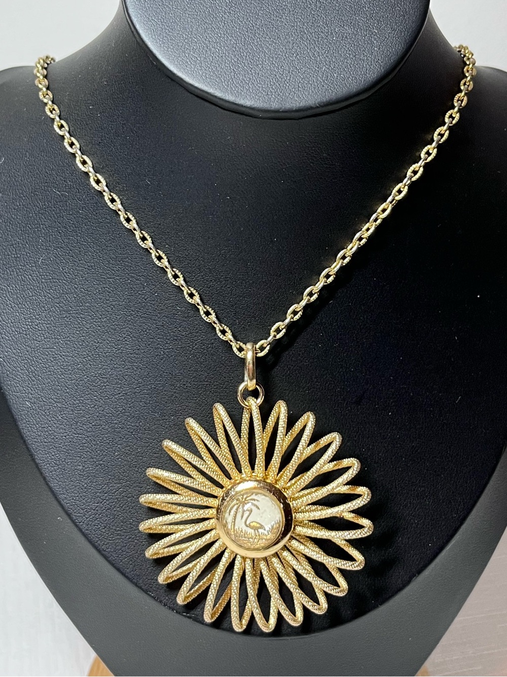 vintage mid-century gold-tone starburst pendant necklace
West Germany